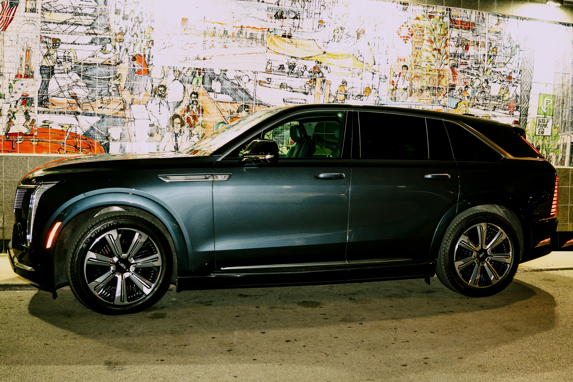 Black Cadillac Escalade IQ, full side profile — first class